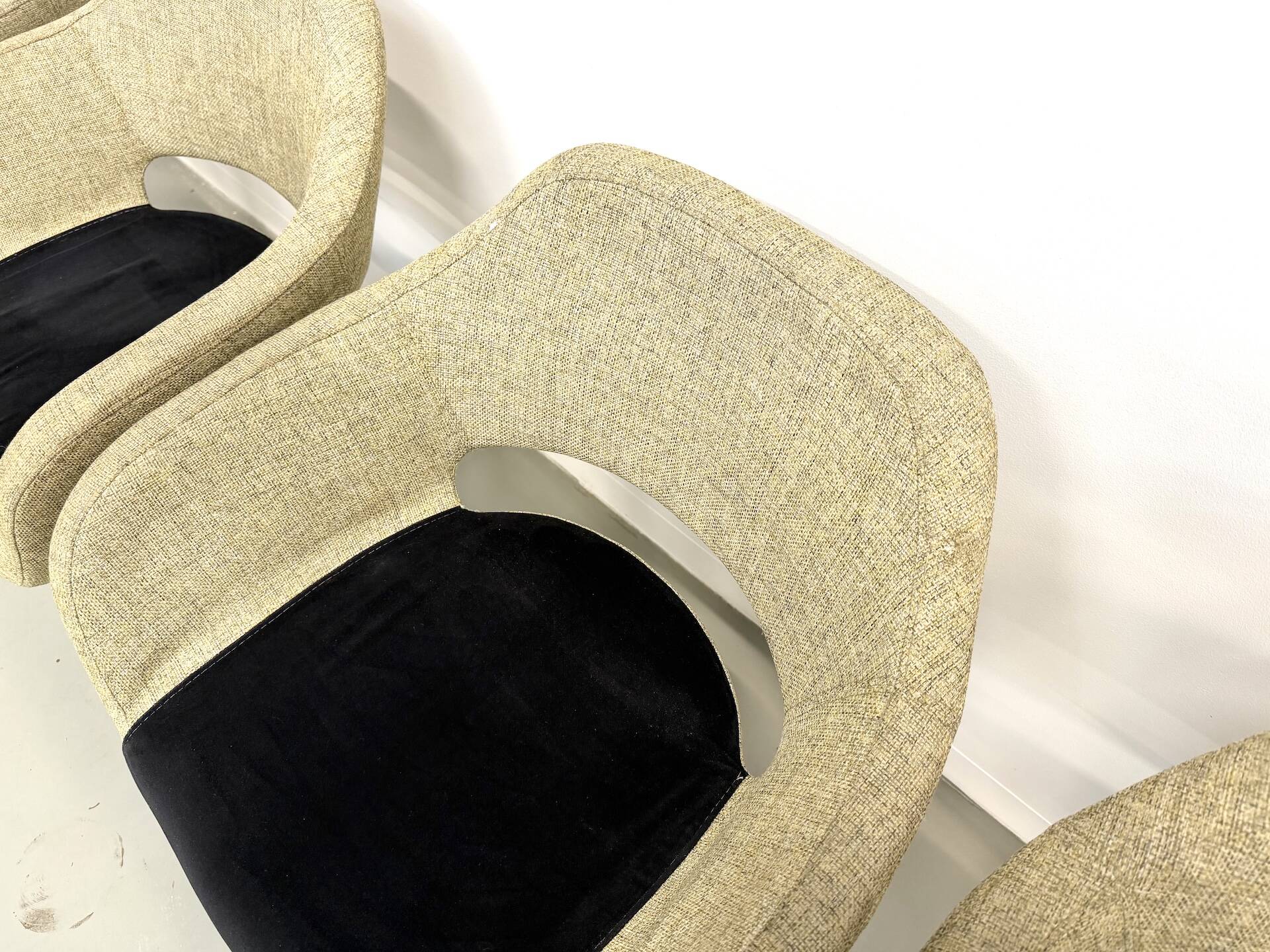 Series of six swivel chairs with an organic shell, patterned fabric and base.
