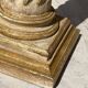 Wooden column in Corinthian style with gilding.