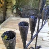 Brutalized wrought iron candle holder