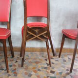 Lot of 8 vintage wooden chairs and red skai