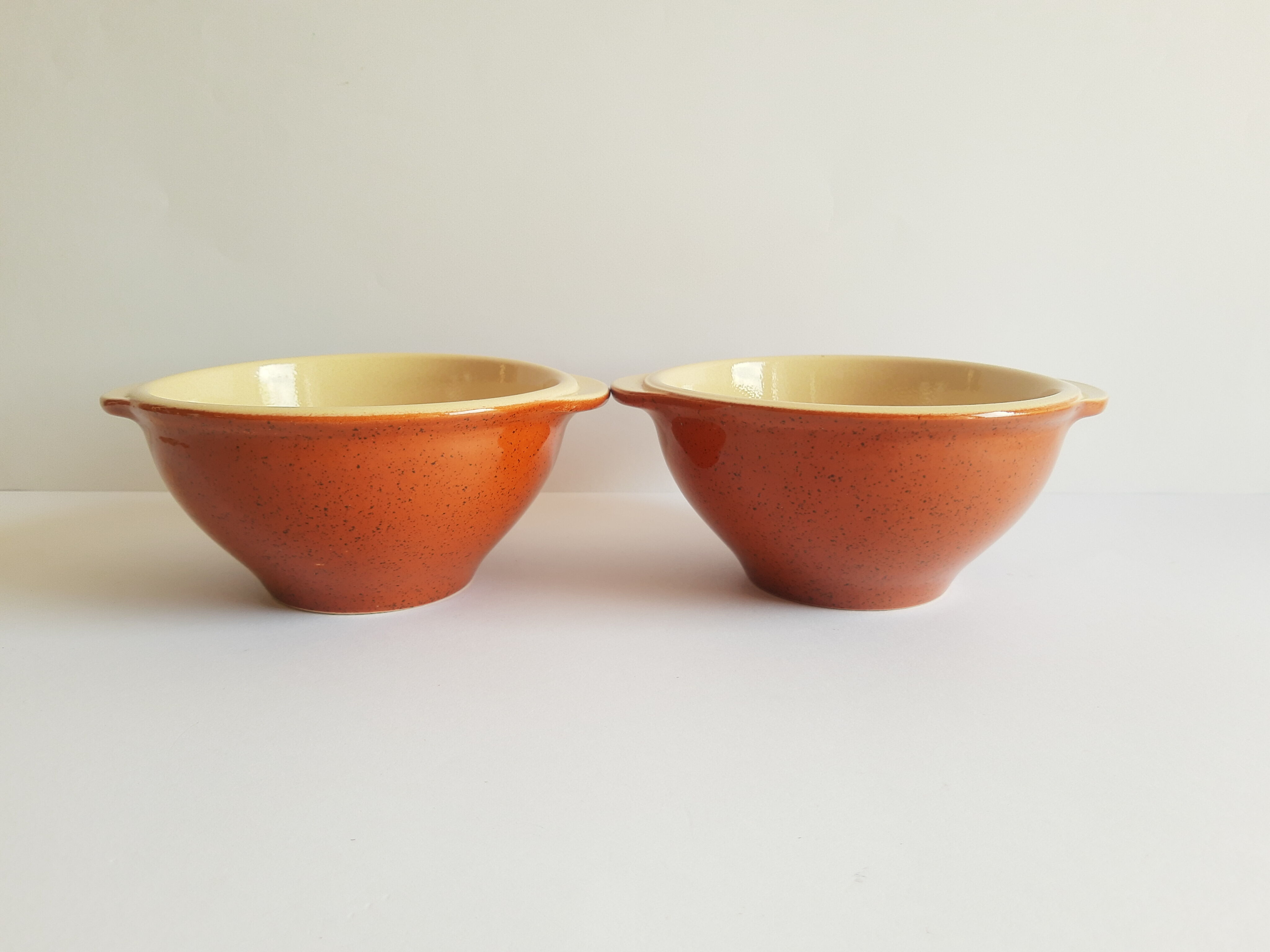 Duo of vintage Emile Henry cognac ear bowls