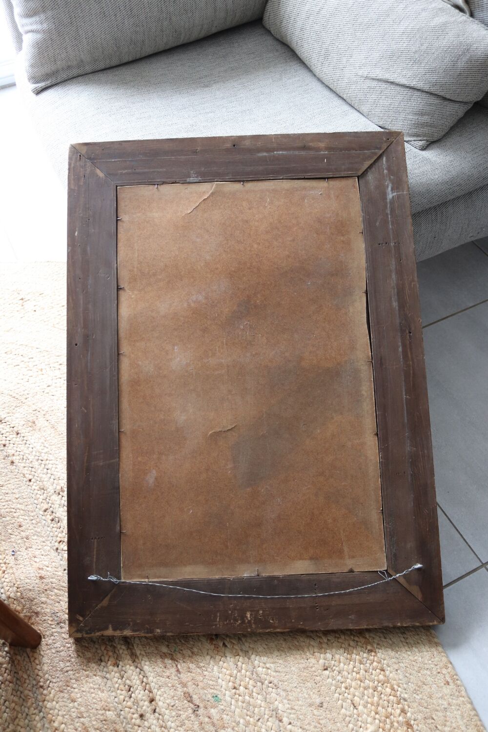 Antique mirror with a carved and painted wooden frame