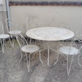 Wrought iron garden furniture from the early 20th century.