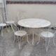 Wrought iron garden furniture from the early 20th century.