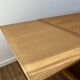 Solid oak farmhouse table with extensions.