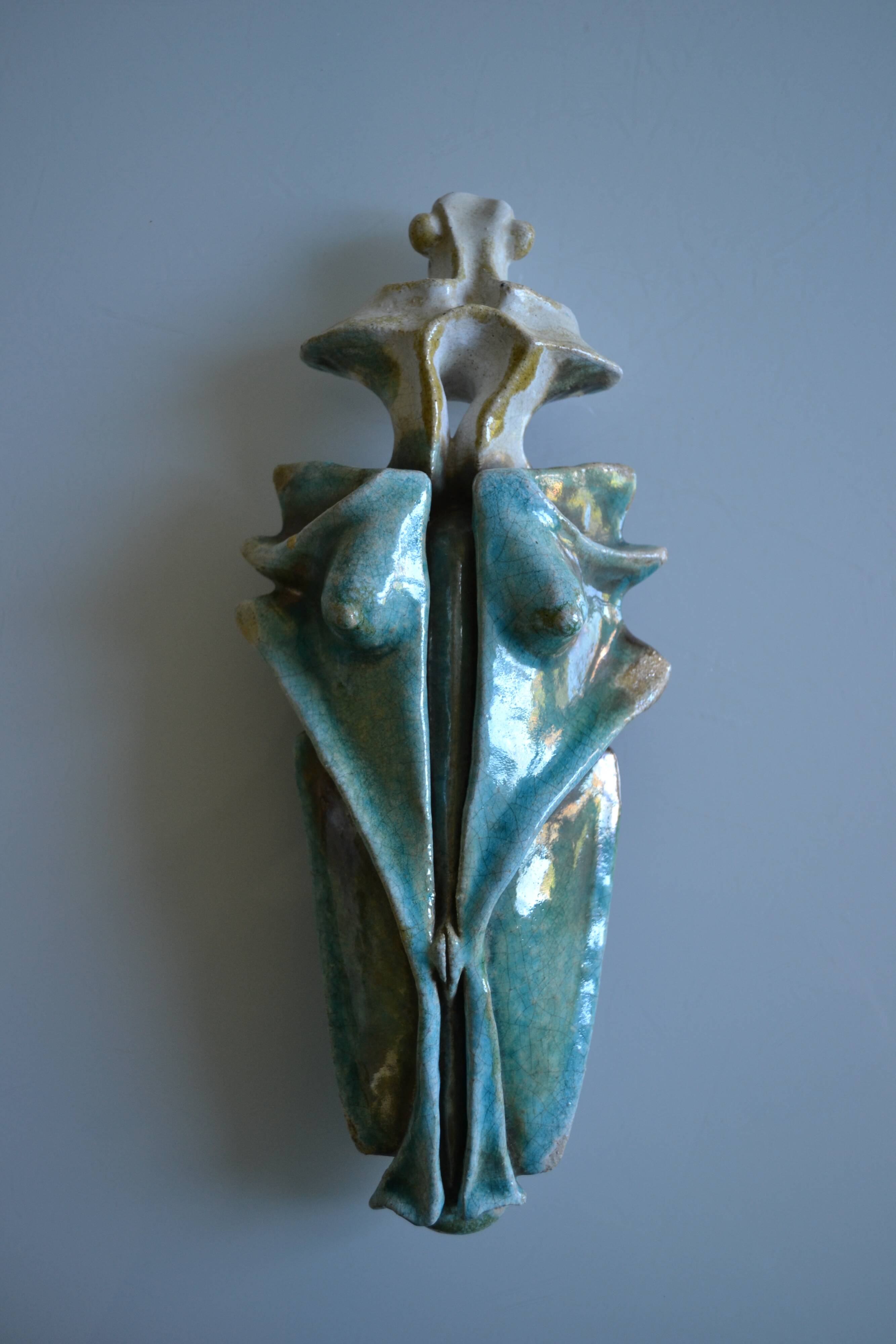 Surreal ceramic sculpture in relief signed to be identified.