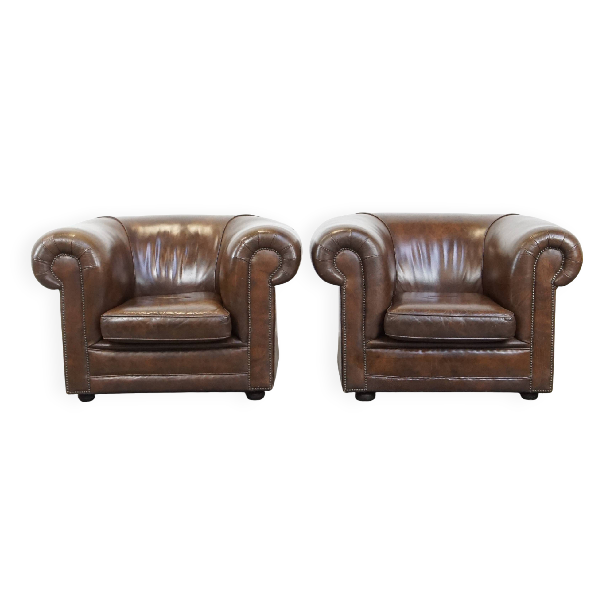 2 Chesterfield armchairs in dark brown cowhide