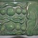 Green enamelled ceramic stove tile — finely sculpted Hungarian pattern from the late 19th century.