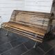 Old cast iron garden bench with oak slats