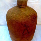 Demijohn dressed in burlap and padded cork