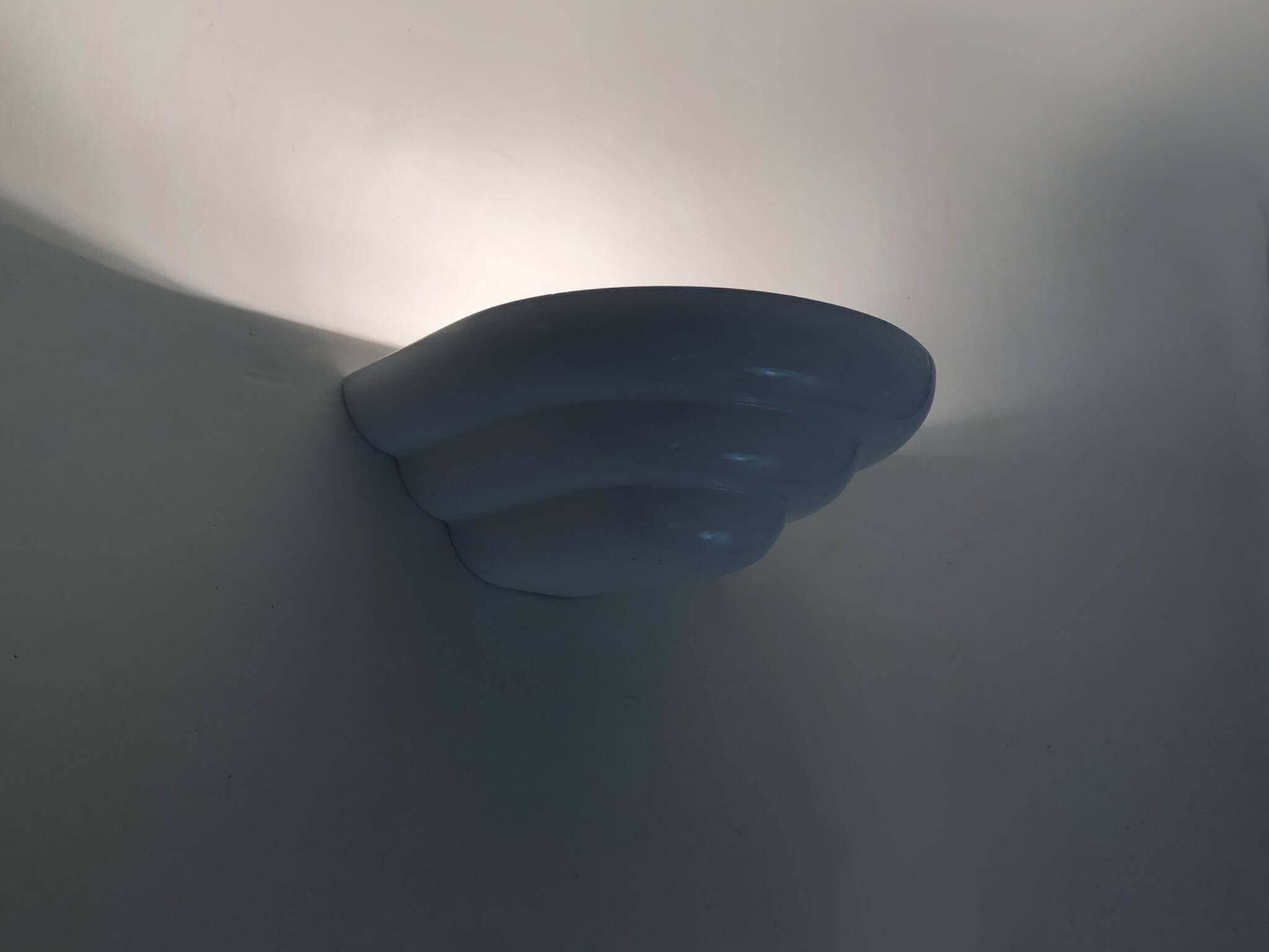 Pair of Art Deco style wall lights in white lacquered metal. 1980s