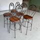 High chairs in rosewood and wrought iron