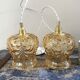 Set of two suspensions in gilded chiseled glass