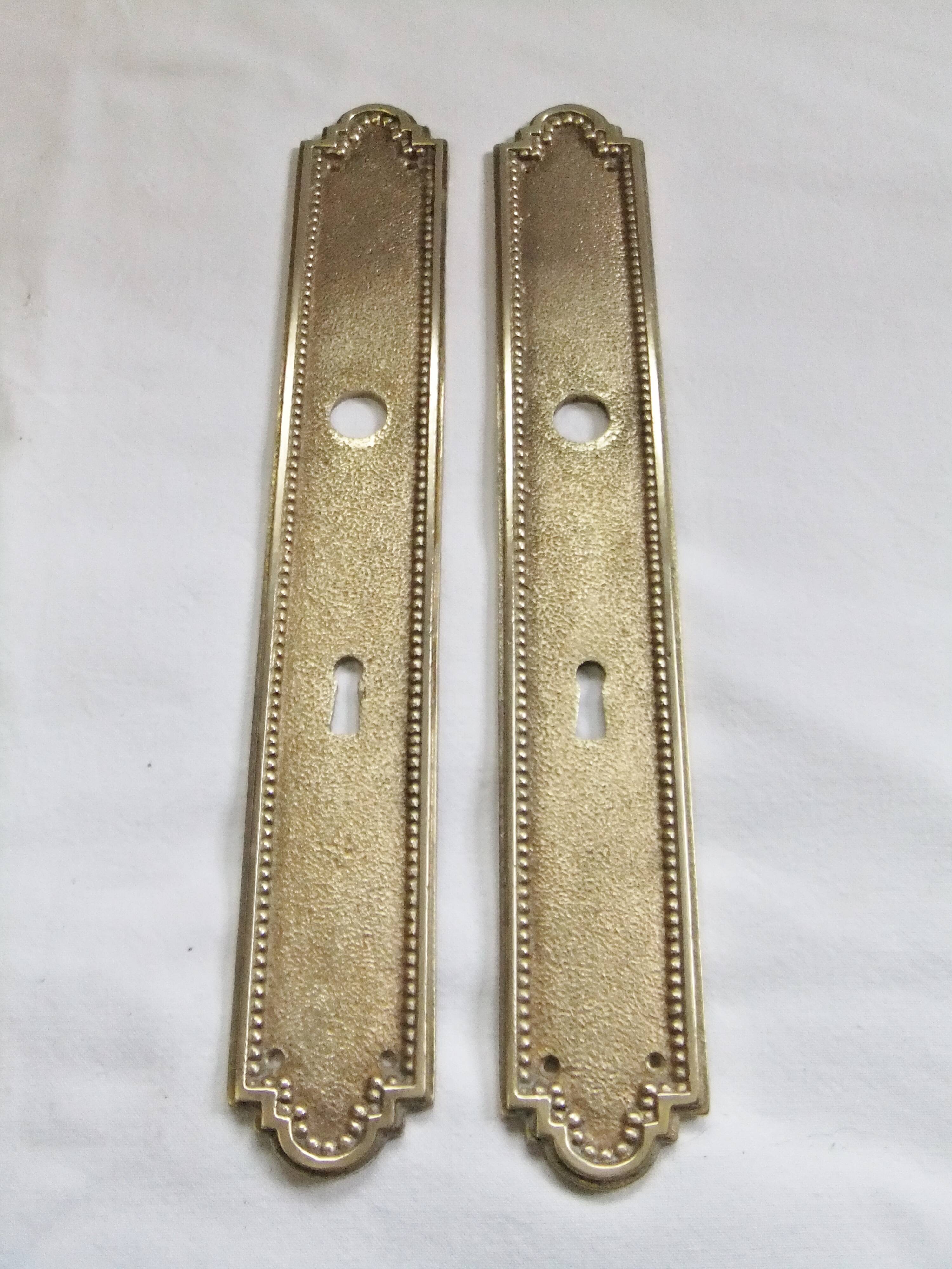 Pair of Louis XVI style beaded bronze door handles