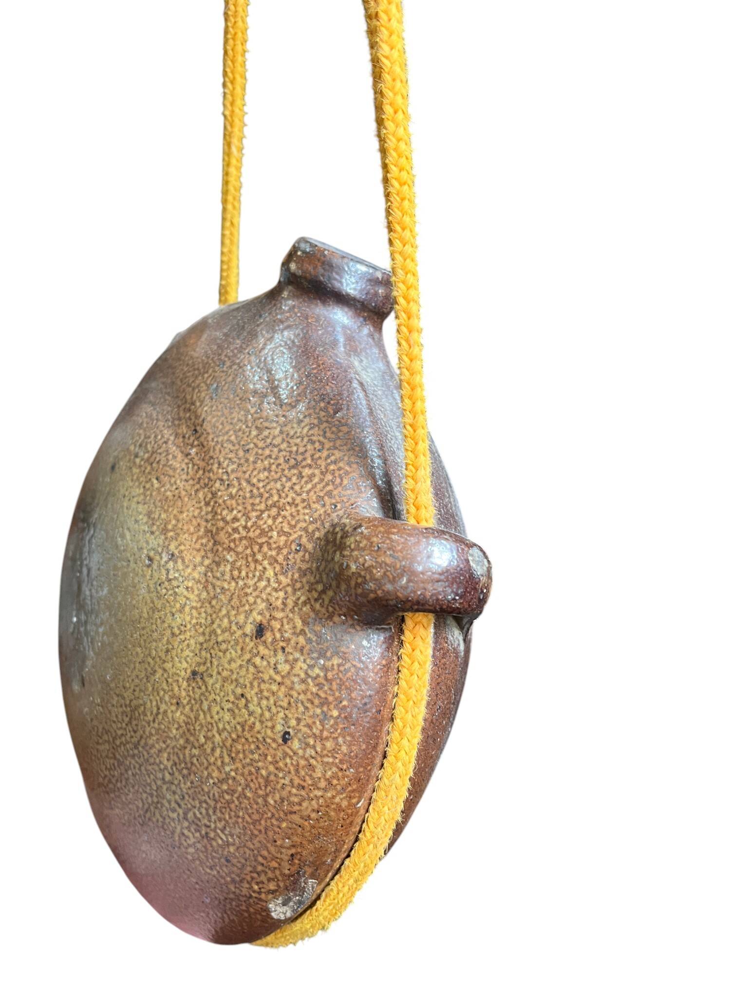 Old stoneware flask known as a toad from the 19th century.