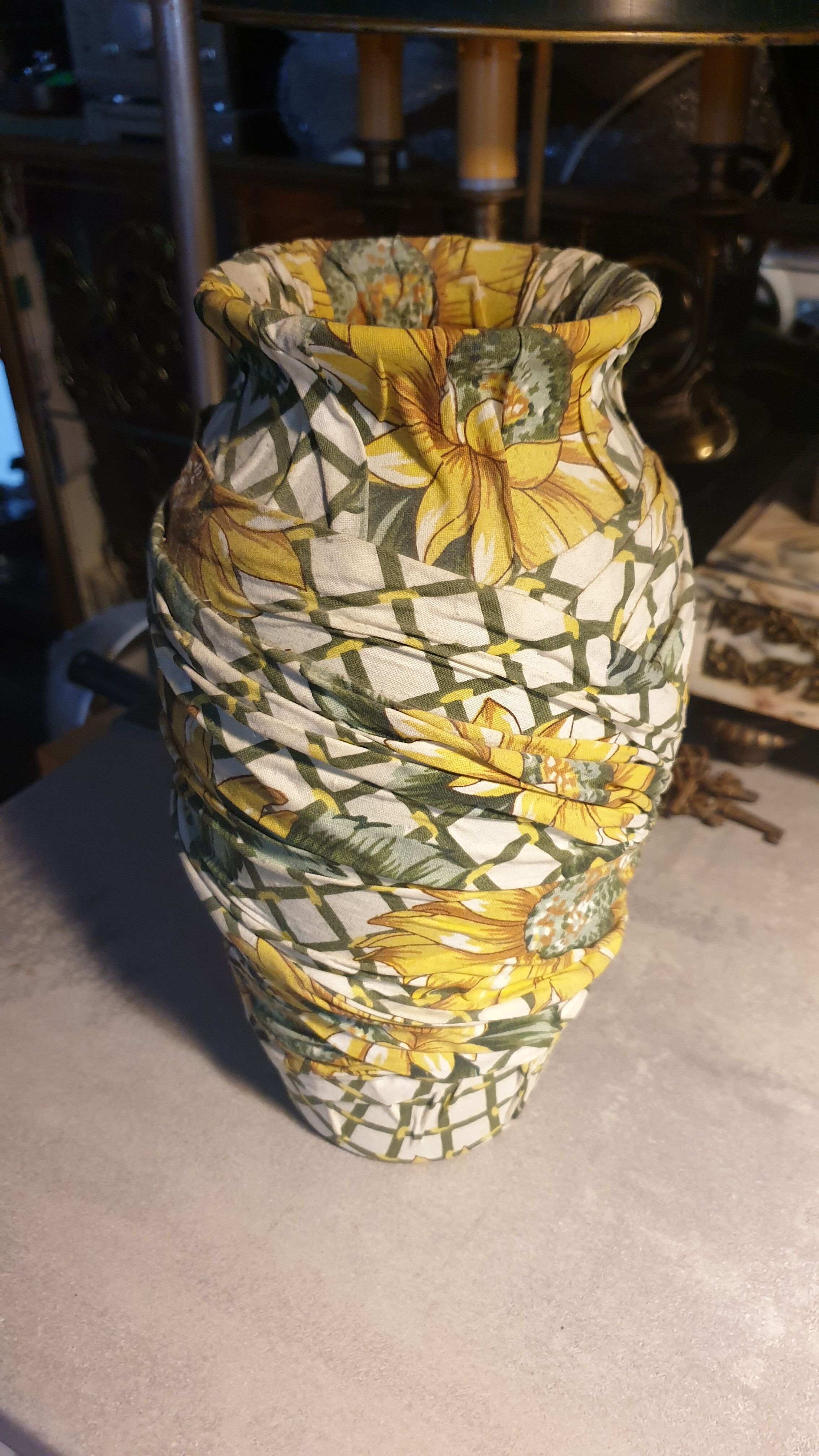 Vase and ceramic cup in fabrics