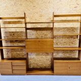 Modular wall-mounted bookcase in walnut