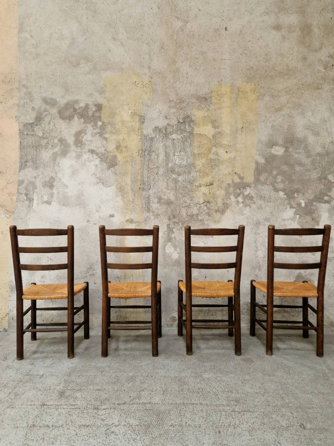 4 wooden and straw chairs