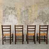 4 wooden and straw chairs