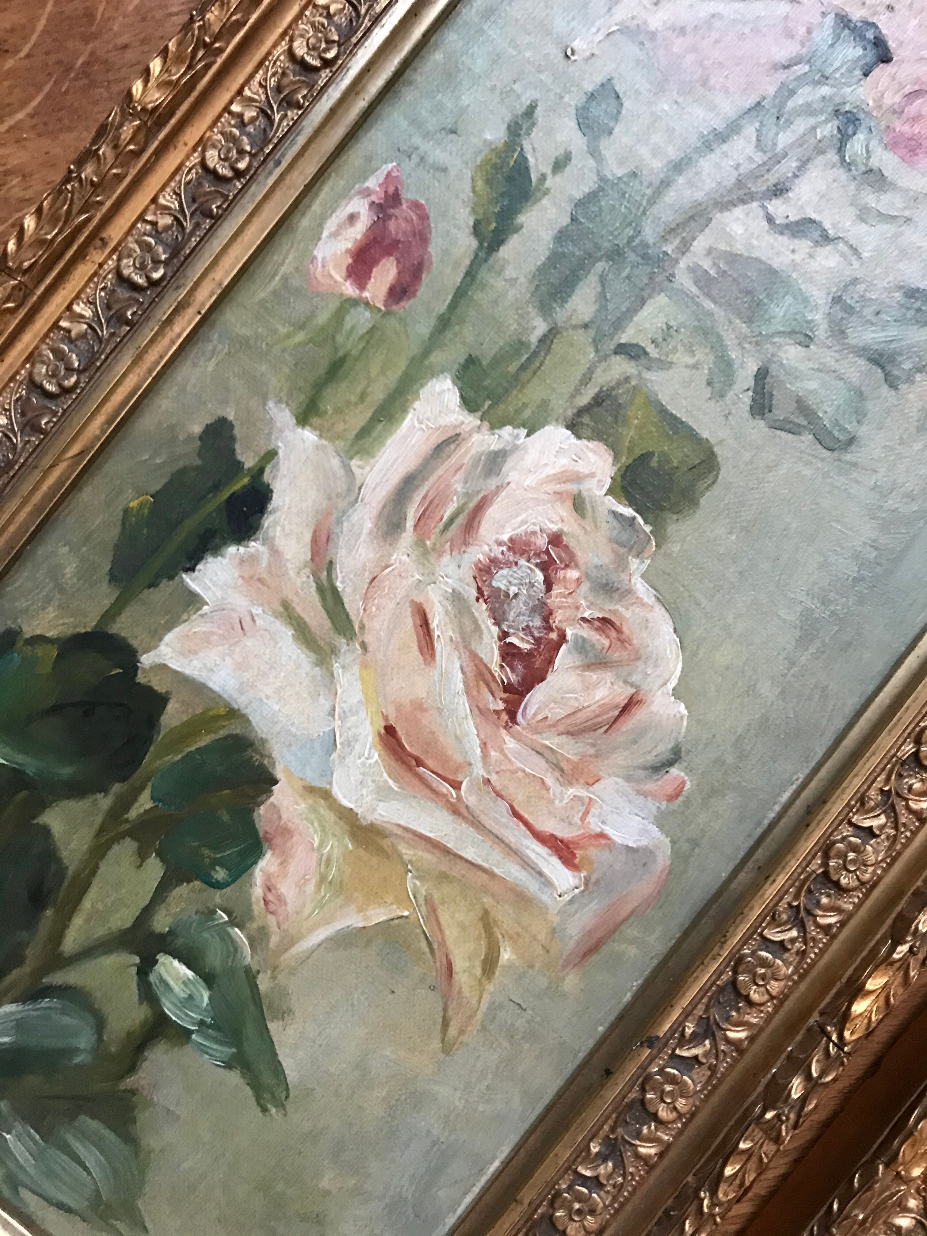 Two old paintings of flowers and gilded frames