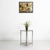 Bolster or end table in chrome steel with smoked window.
