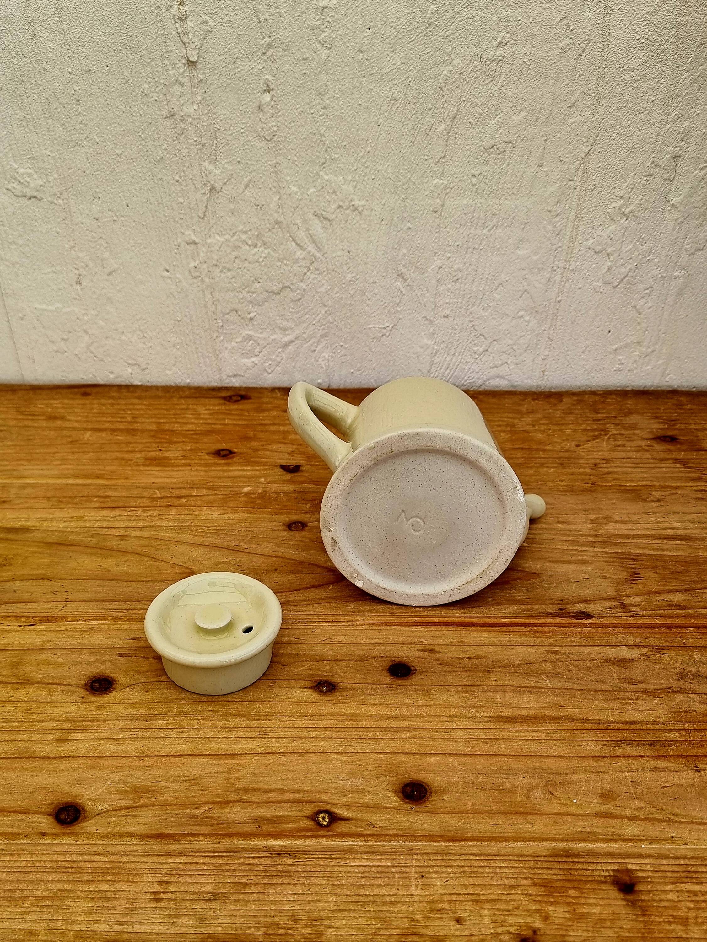 Vintage pastel yellow teapot