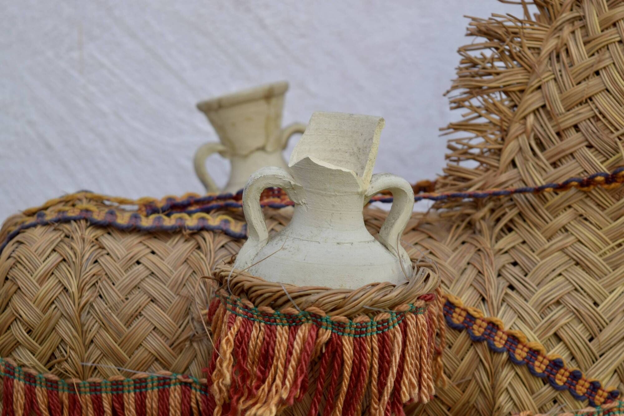 Spanish decorative donkey in raffia carrying two jars - 62 cm high - 1950