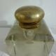 Old and imposing thick glass desk inkwell, gold brass lid