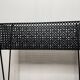 1950s black perforated metal planter in the style of Mathieu MATEGOT