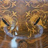 Coffee table in walnut with maple inlays and wheels