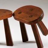 Pair of tripod brutalist stools, France 1950s