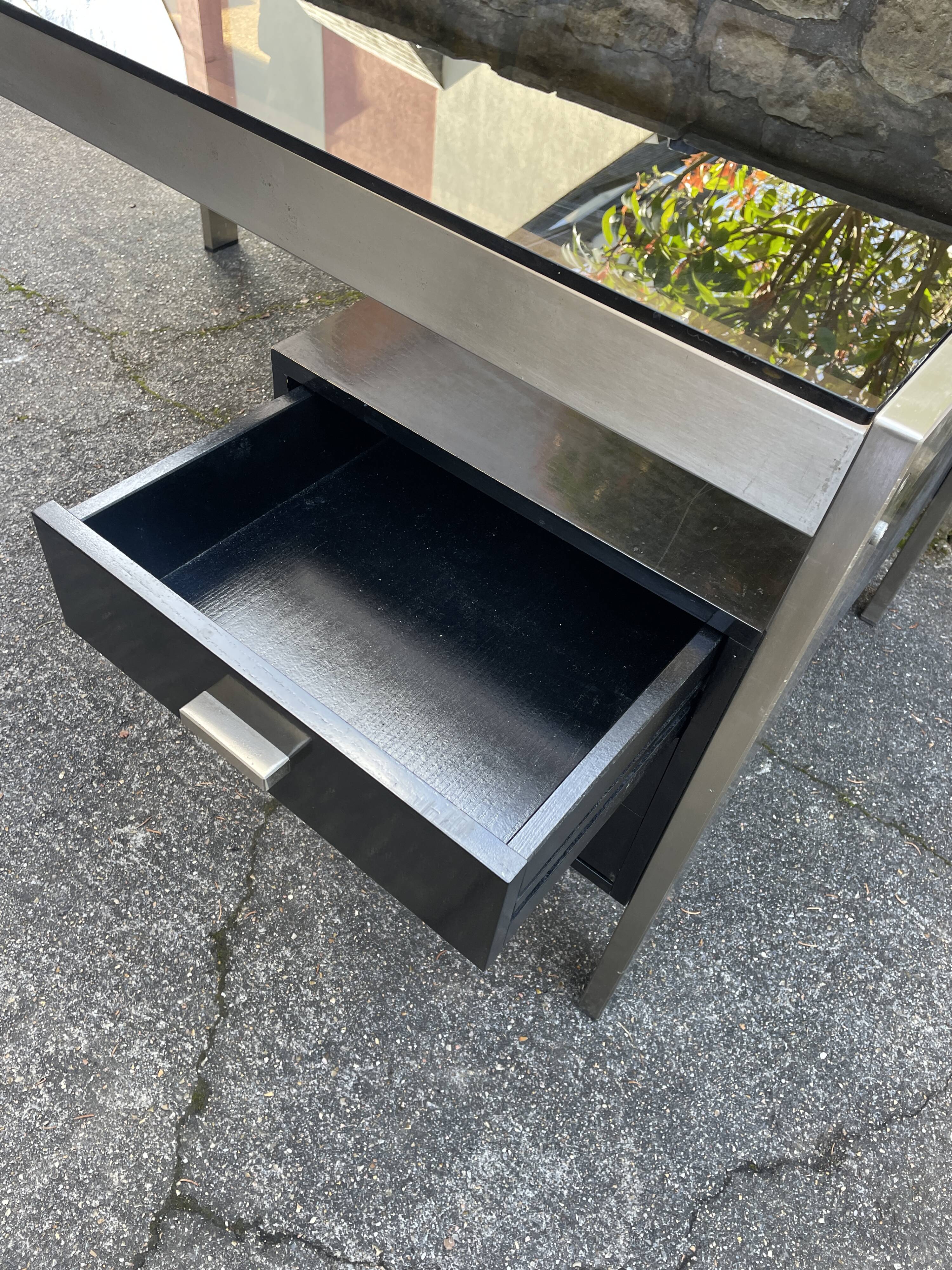 Vintage desk in smoked glass and brushed steel. 1970. Suspended box