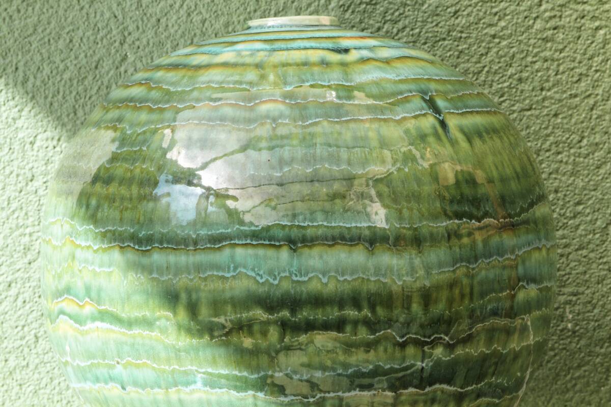 Glazed ceramic ball lamp base, green gradients.