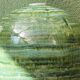 Glazed ceramic ball lamp base, green gradients.