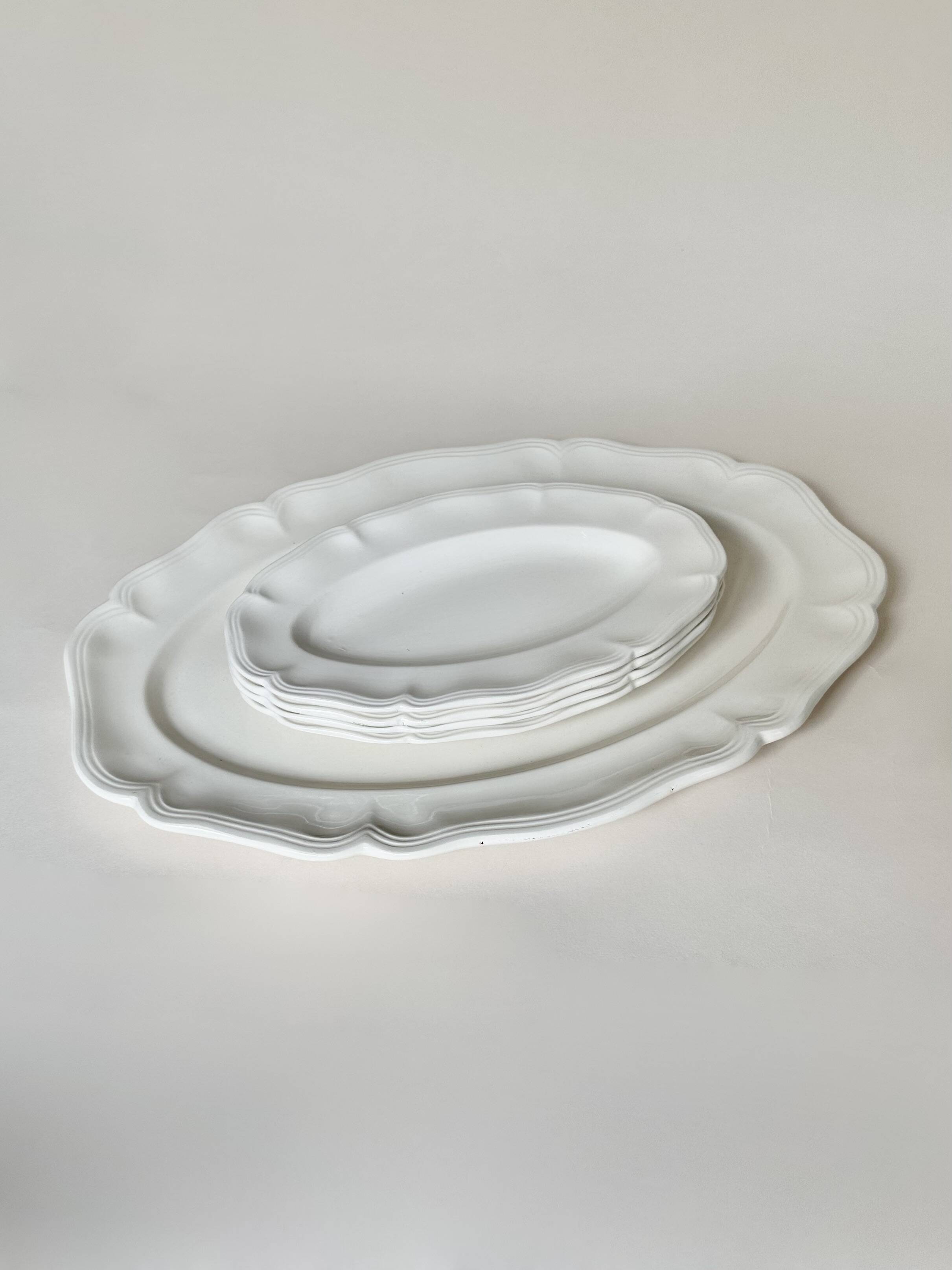 Shaped plates and dishes in Sarreguemines earthenware.