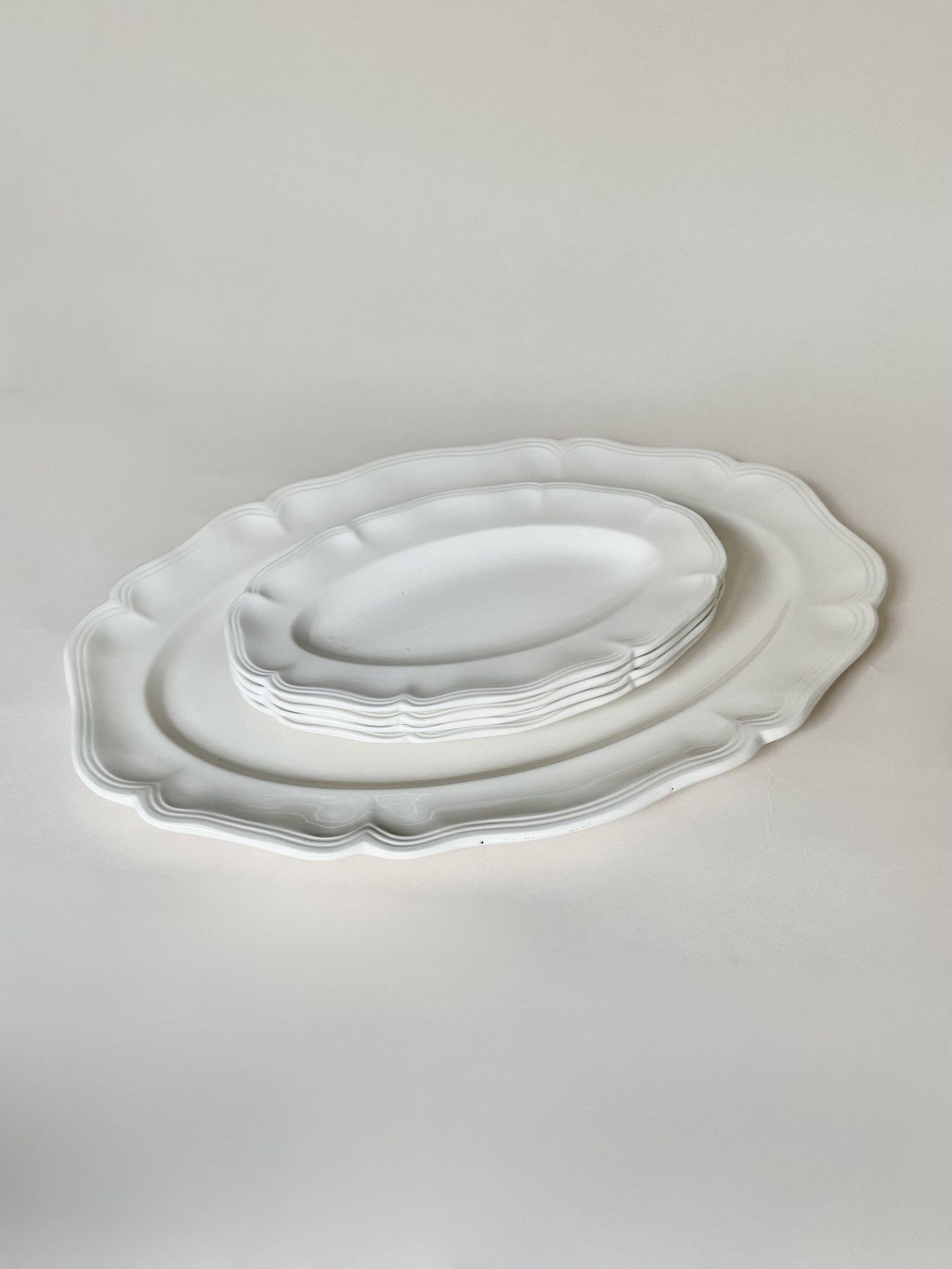 Shaped plates and dishes in Sarreguemines earthenware.
