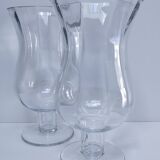 Pair of tall clear glass candlesticks from the early 20th century