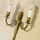 Louis XVI bronze wall sconces from the 19th century with quiver decorations.