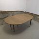 Half-moon extendable oak table for 2 to 8 people.