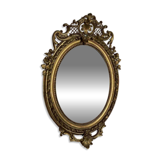 Large oval Napoleon III gilded mirror