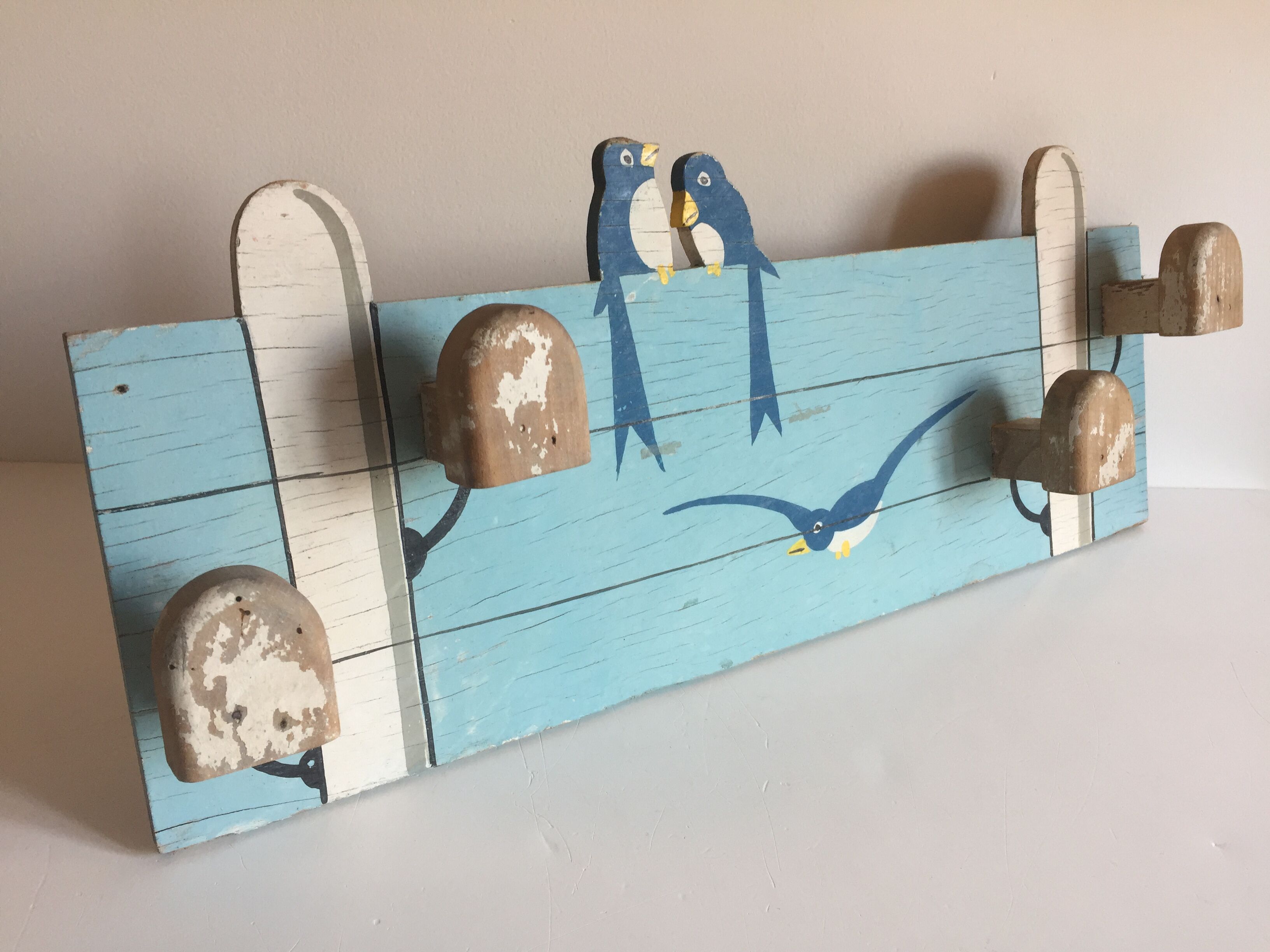 Coat rack with vintage swallows