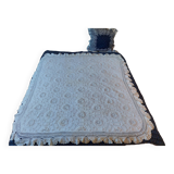 White bed throw with relief embroidery and floral patterns