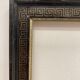 Black and gold frame decorated with Greek frieze decoration