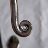 Twisted metal cutlery with a fancy spiral design.