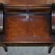Antique entrance bench by Jas Shoolbred with brass fittings and walnut frame circa 1890.