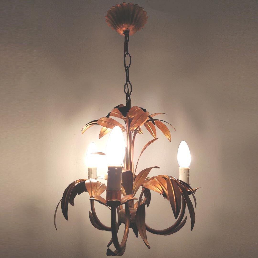 Golden metal chandelier palm leaves