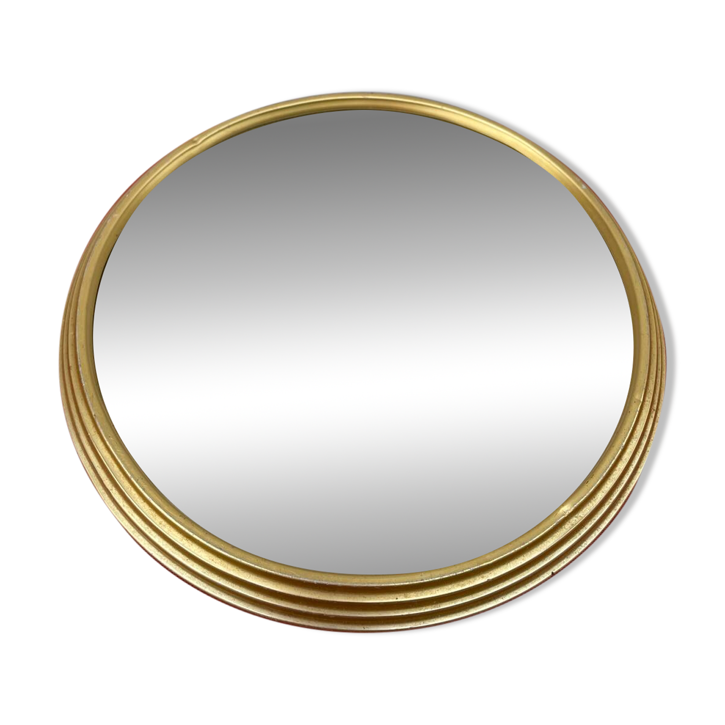 Round mirror in gold metal