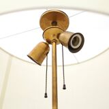 Floor lamp with a brass base and parchment shade, 1940s.