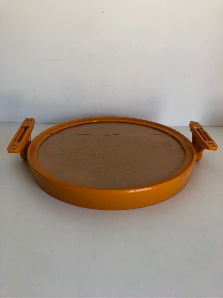 Tiltable orange plastic mirror with matching wall light