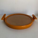 Tilting orange plastic mirror with its matching wall light